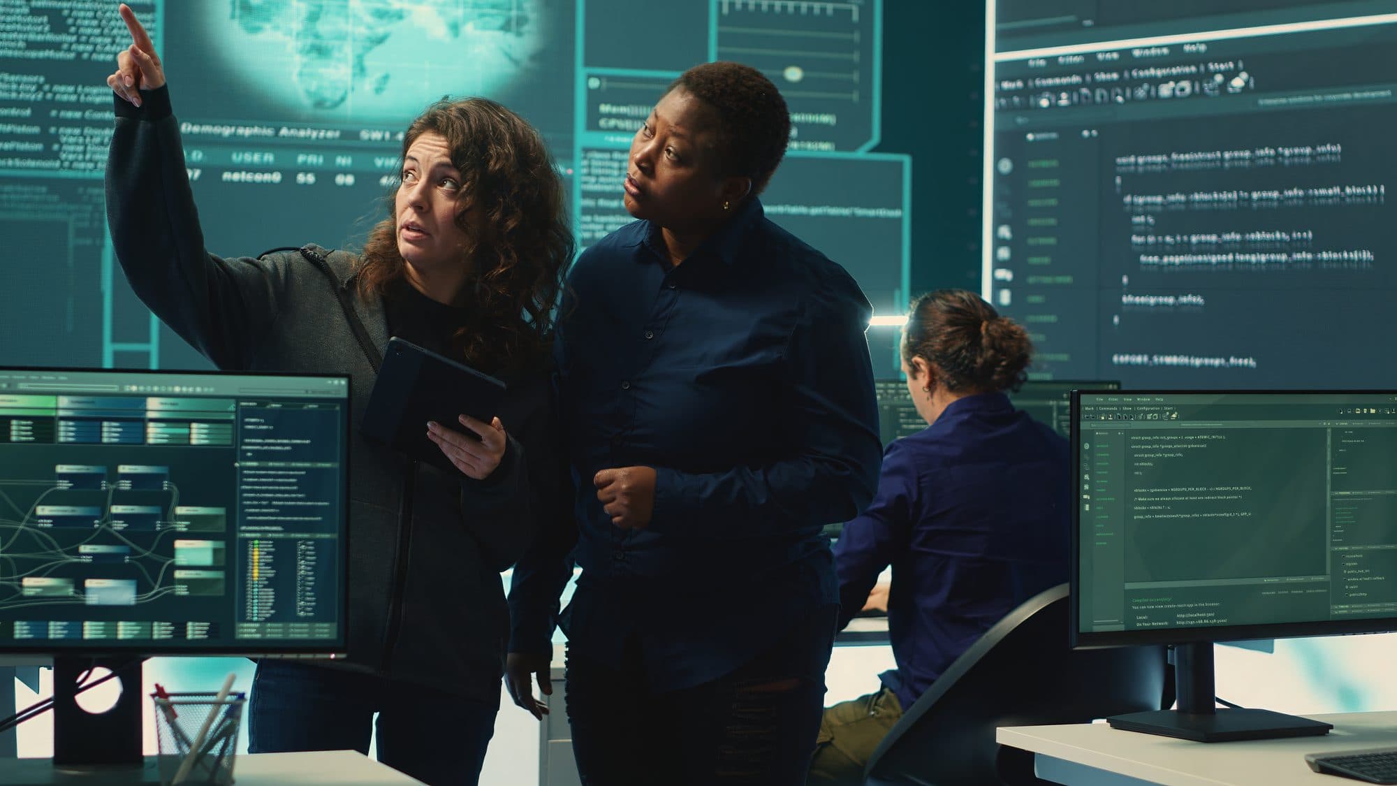 A cybersecurity specialist monitoring systems