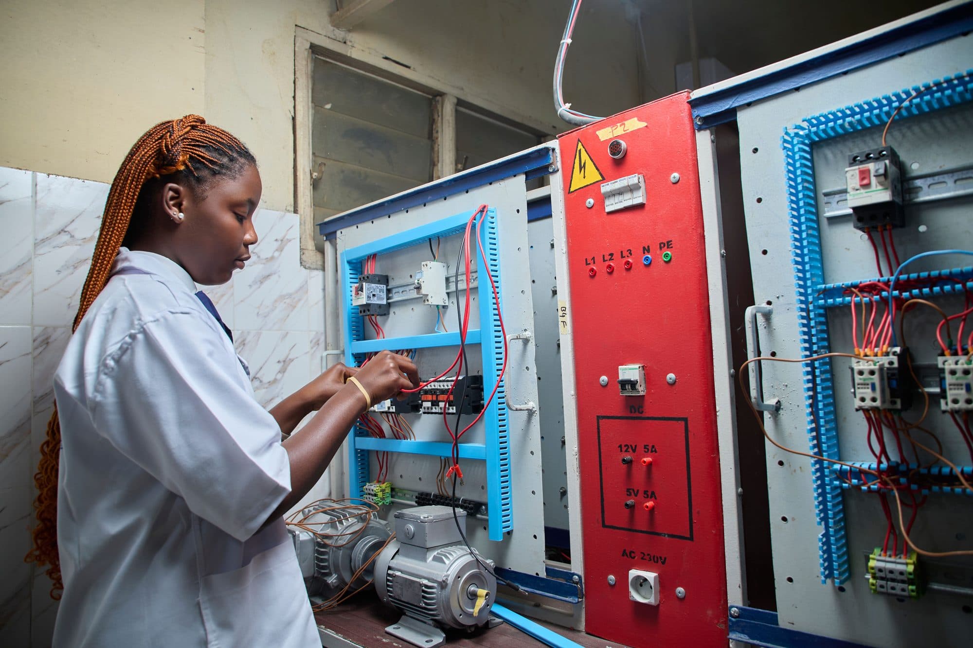 An electrician working on wiring